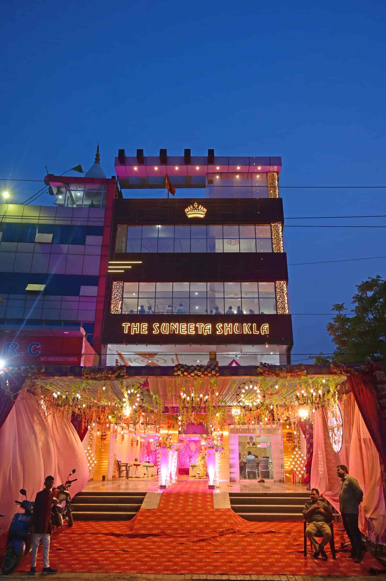 The Suneeta Shukla Empire building lit up at dusk