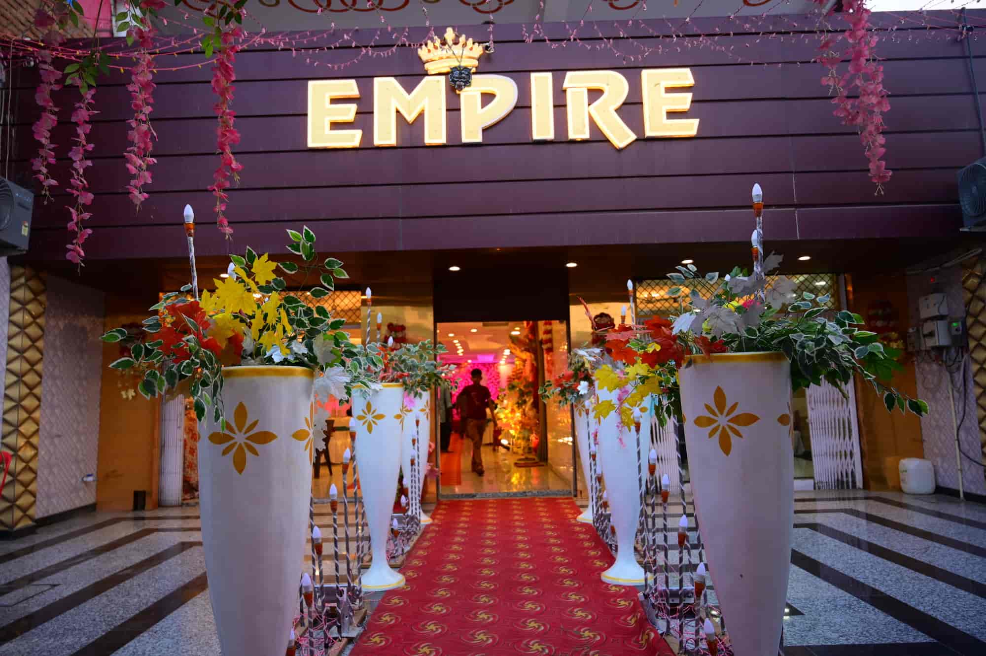 Gold EMPIRE sign above the hotel lobby